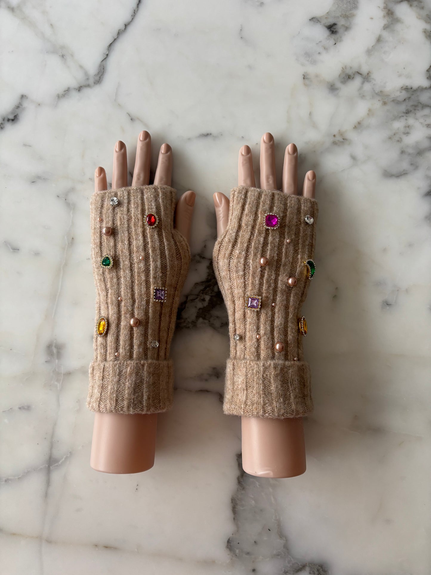 Pair of brown fingerless gloves with decorative gems