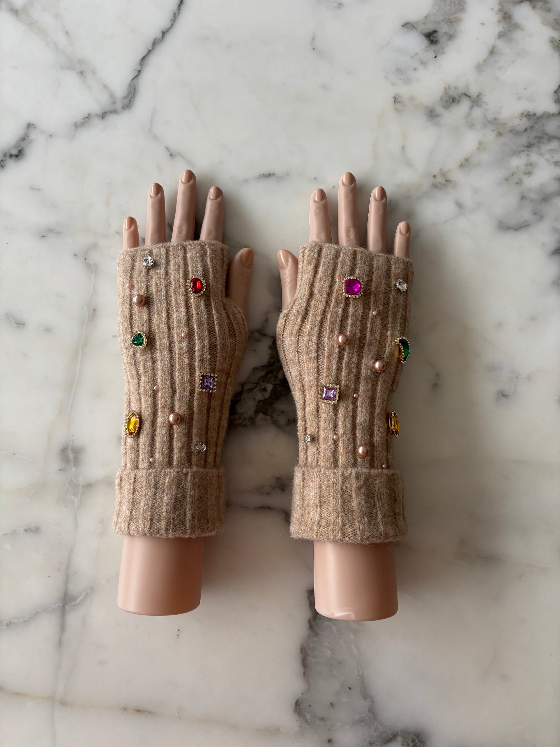 Pair of brown fingerless gloves with decorative gems